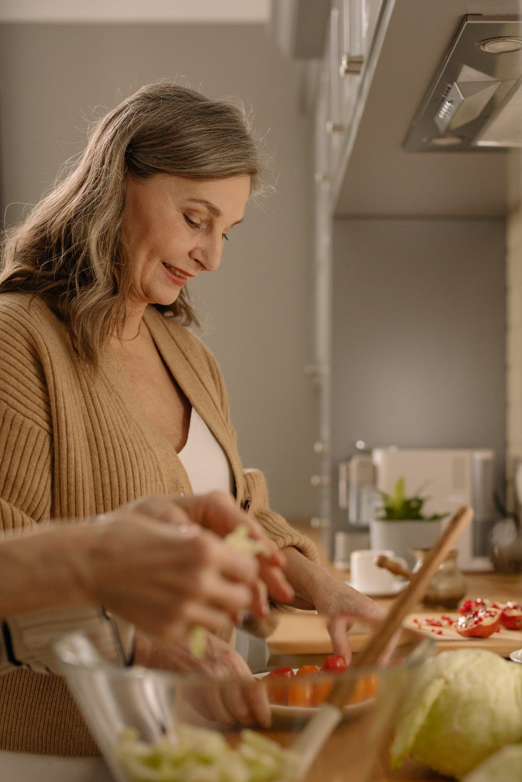 Woman preparing a salad in her kitchen